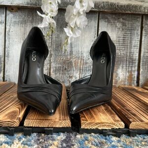 Black patent leather heels.